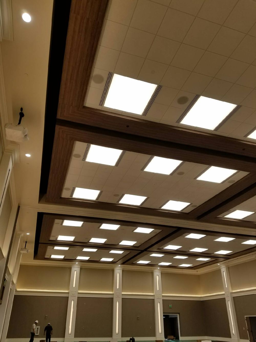 Crew completing a large coffered ceiling with integrated air distribution